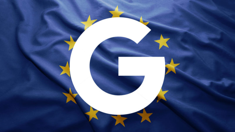 ```json
{
  "alt": "Google logo overlaid on a European Union flag with yellow stars on blue background.",
  "caption": "A bold overlay of the Google logo on the EU flag signals a digital dialogue between tech giant and Europe.",
  "description": "The image features a prominent Google logo superimposed on the European Union flag, which consists of twelve yellow stars arranged in a circle on a blue background. This powerful visual juxtaposes a major global tech company's presence with the political and economic union of Europe, symbolizing interactions and relationships between global tech and regional governance. Keywords: Google, EU flag, technology, Europe, digital relations."
}
```