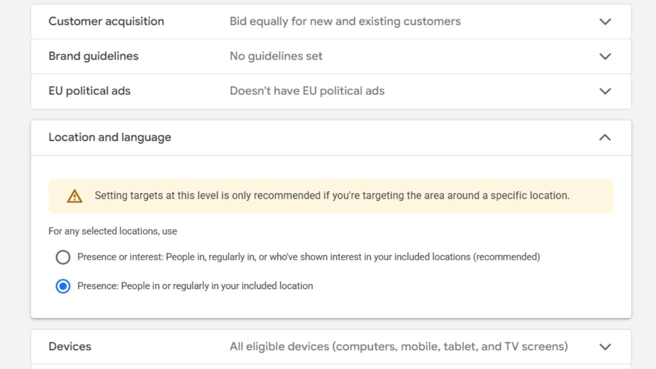 ```json
{
  "alt": "Google Ads settings panel showing location targeting options and preferences.",
  "caption": "Discover how to fine-tune your Google Ads location settings to enhance your campaign's reach and precision in targeting audiences.",
  "description": "This image displays a Google Ads settings panel focusing on location and language preferences. It advises on setting location targets, with options for targeting based on presence or interest. A warning suggests that setting targets at this level is recommended for specific locations. This panel helps advertisers tailor their campaigns by choosing between 'Presence or interest' and 'Presence' targeting options. Keywords: Google Ads, location targeting, advertising settings."
}
```