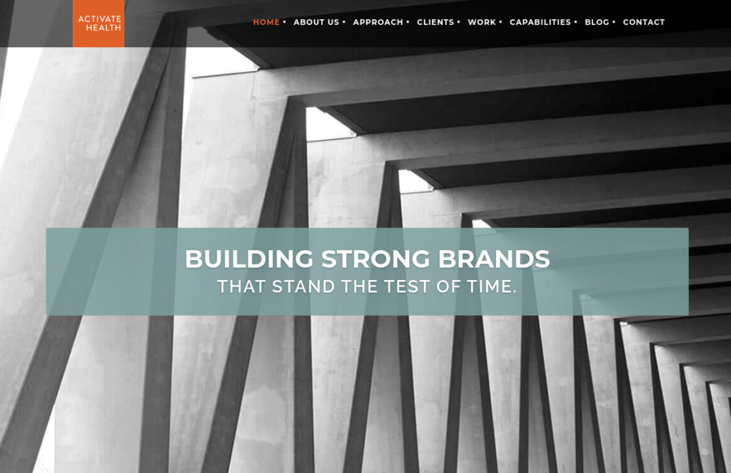 ```json
{
"alt": "Website homepage showing a geometric architectural design with text 'Building Strong Brands'.",
"caption": "Capturing the essence of brand resilience, this image on Activate Health's homepage features a striking architectural design symbolizing strength and longevity.",
"description": "The homepage of Activate Health features a black and white image with geometric architectural beams, symbolizing strength and stability. Overlaid is the text 'Building Strong Brands That Stand the Test of Time', highlighting the company's focus on durable brand creation. The modern design with a monochromatic palette reflects a professional and forward-thinking approach. Ideal for use in marketing, branding, and digital presence discussions."
}
```