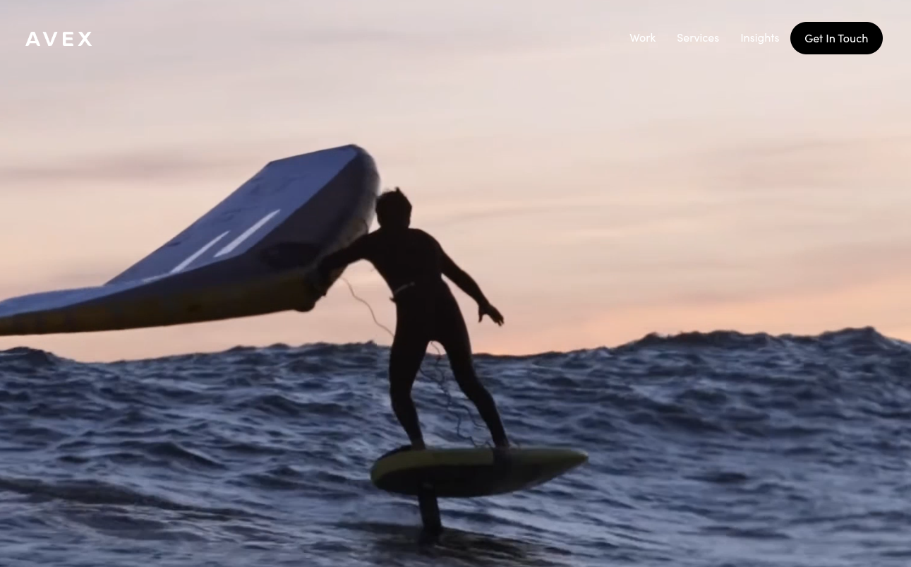 ```json
{
  "alt": "Person on a hydrofoil board holding a wing, silhouetted against an ocean sunset.",
  "caption": "Riding the waves into sunset: a breathtaking moment captured as a silhouette flies across the ocean on a hydrofoil board under the glow of a setting sun.",
  "description": "This image features an individual expertly maneuvering a hydrofoil board across the ocean, silhouetted against a stunning sunset. The rider balances on the board while holding a wing sail, showcasing the dynamic and adventurous sport of wing foiling. The scene captures the beauty of nature and the daring spirit of the sport, making it an inspiring and visually striking moment. Keywords: hydrofoil, wing foiling, ocean, sunset, silhouette."
}
```