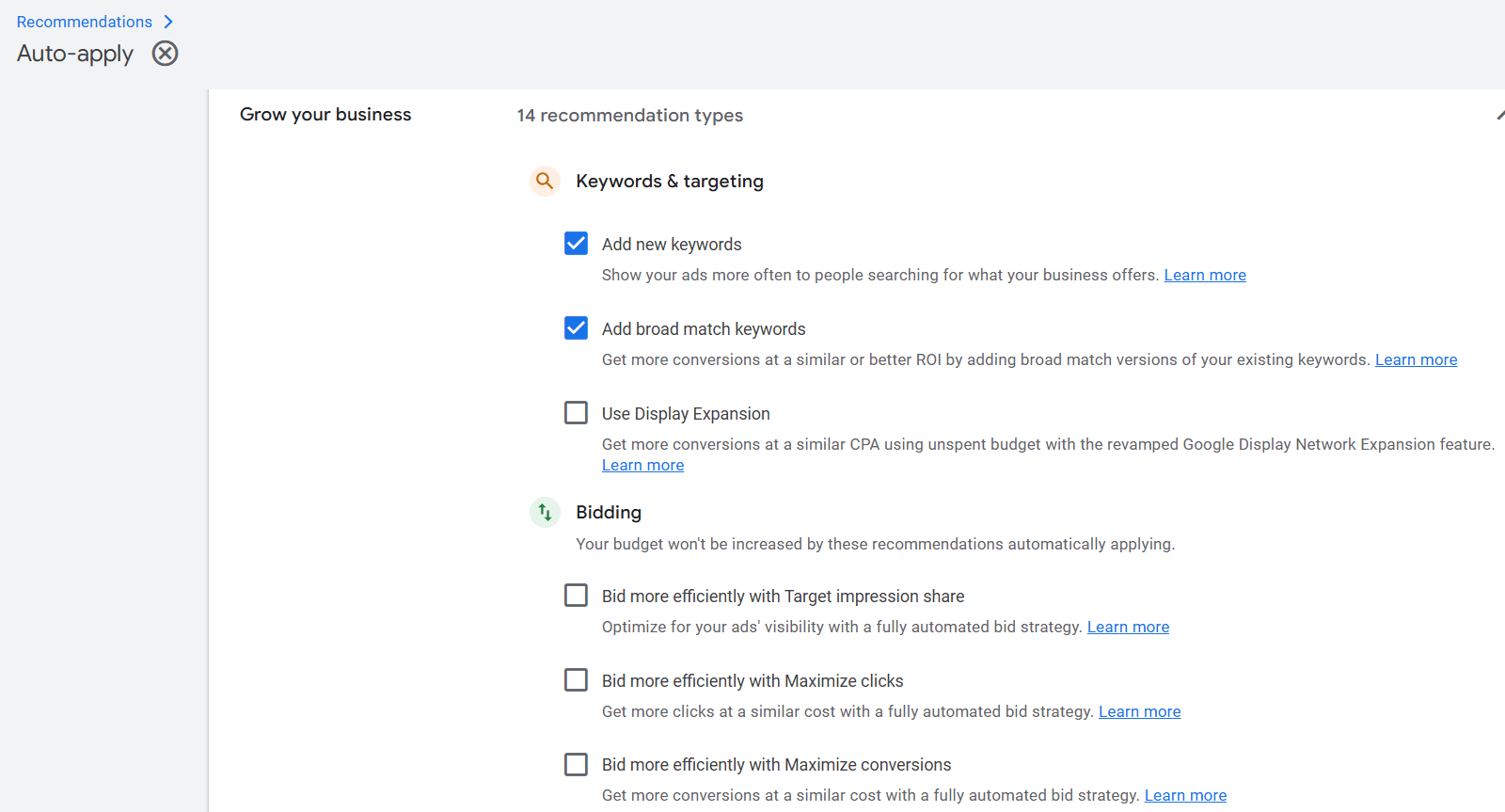 ```json
{
"alt": "Google Ads recommendations for keywords and bidding strategies",
"caption": "Level up your ad campaigns with Google Ads' tailored recommendations for keywords and bidding strategies, helping you optimize performance and reach.",
"description": "This image shows a Google Ads recommendations page for optimizing ad campaigns. It includes suggestions for keywords and targeting, such as adding new and broad match keywords, and bidding strategies to maximize impressions, clicks, and conversions. Checkboxes indicate selectively applied suggestions. These insights help improve ad reach and efficiency."
}
```