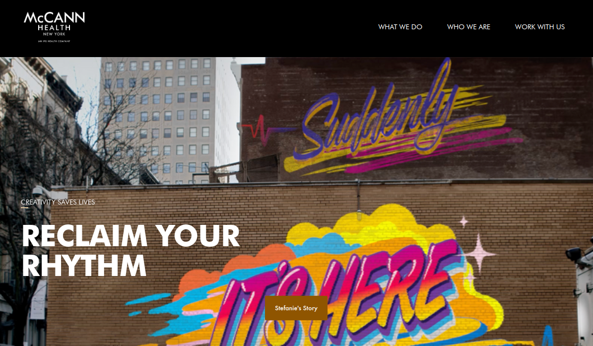 ```json
{
"alt": "Graffiti on a city wall reads 'Suddenly' and 'It's here' with vibrant colors. McCann Health New York website header text says 'Reclaim Your Rhythm'.",
"caption": "Urban creativity meets health advocacy. McCann Health New York invites you to 'Reclaim Your Rhythm' through vibrant graffiti art that speaks volumes.",
"description": "This image features a cityscape where colorful graffiti art on a brick wall displays the words 'Suddenly' and 'It's Here'. The website header, part of McCann Health New York, reads 'Reclaim Your Rhythm', reflecting a creative campaign. The vibrant street art symbolizes energy and revitalization, aligning with the message of health and innovation. The scene beautifully captures the intersection of urban art and health communication, blending creativity with impactful storytelling."
}
```