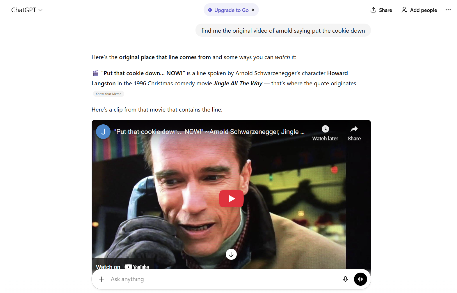 ```json
{
  "alt": "ChatGPT interface displaying a request for the origin of a famous line and showing a related movie clip.",
  "caption": "Uncover the origin of the iconic movie line 'Put that cookie down... NOW!' with a Clip from 'Jingle All The Way'.",
  "description": "The image shows a ChatGPT interface where a user requests the origin of a famous movie line spoken by a character in 'Jingle All The Way'. The response provides the origin and includes a YouTube clip from the movie where the line is spoken. The movie clip shows a character holding a phone and speaking the line. This setup links the line to its cinematic roots. Keywords: ChatGPT, 'Jingle All The Way', movie quote, YouTube clip."
}
```