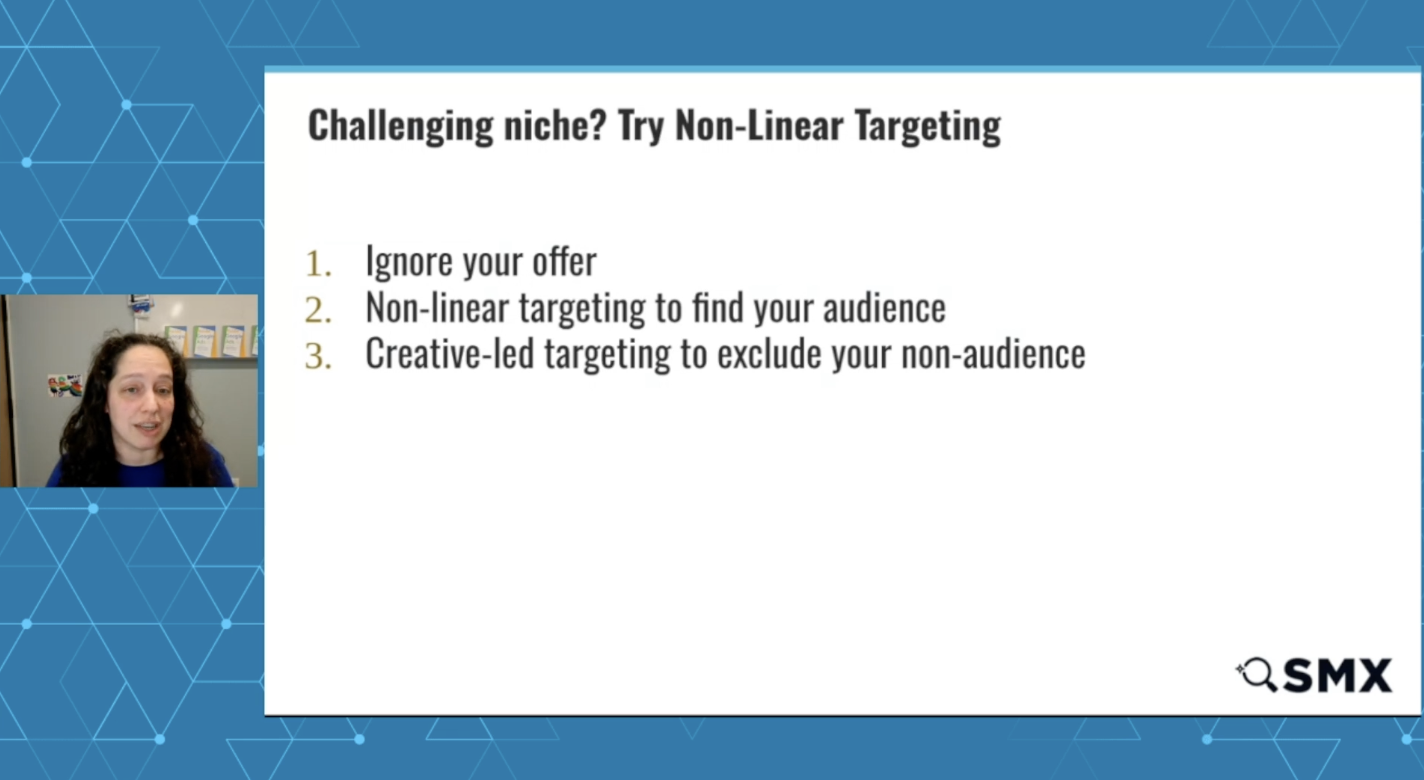 ```json
{
  "alt": "Slide presentation on non-linear targeting with a speaker.",
  "caption": "Unravel the complexity of niche markets with innovative non-linear targeting strategies.",
  "description": "This image features a presentation slide titled 'Challenging niche? Try Non-Linear Targeting' with a list of three points: 1. Ignore your offer, 2. Non-linear targeting to find your audience, and 3. Creative-led targeting to exclude your non-audience. A speaker is visible to the left, engaging with the audience. The design includes a geometric blue background, enhancing the professional and modern look. Keywords: non-linear targeting, niche marketing, creative strategy."
}
```