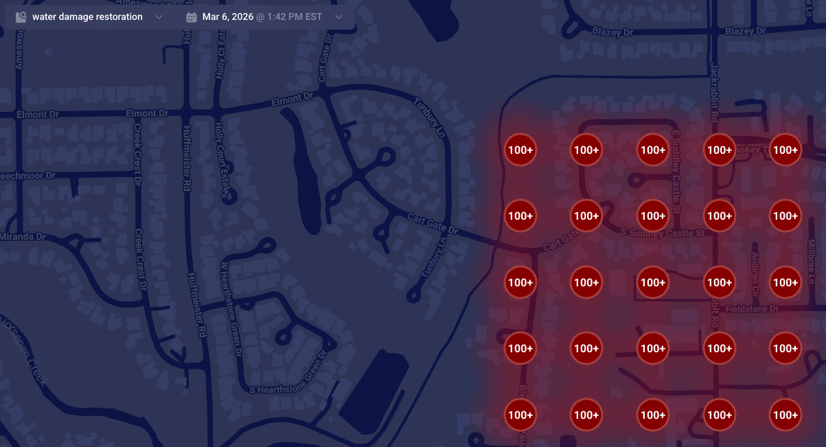 ```json
{
"alt": "Map highlighting areas with over 100 instances of water damage restoration services.",
"caption": "A map visualization displaying clusters of water damage restoration needs, with over 100 cases highlighted in red.",
"description": "This map illustrates a dense concentration of water damage restoration demands in a residential area. Red circles marked with '100+' indicate regions with over 100 service instances. The map is set against a dark background, featuring roads and street names for context. This visualization aids in identifying service hotspots, essential for targeting restoration efforts efficiently."
}
```
