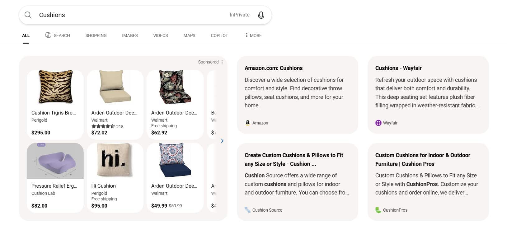 ```json
{
  "alt": "Google search results for cushions, showing various shopping options from different retailers.",
  "caption": "Explore a range of stylish cushions from top retailers. Enhance your home with unique designs and comfortable seating options.",
  "description": "This image displays search results for 'Cushions' on a Google interface, showing various cushion options available from retailers like Perigold, Walmart, and Cushion Lab. The results include products with prices and ratings, alongside sponsored content from Amazon and Wayfair, offering a variety of styles and custom cushion options for home decor."
}
```