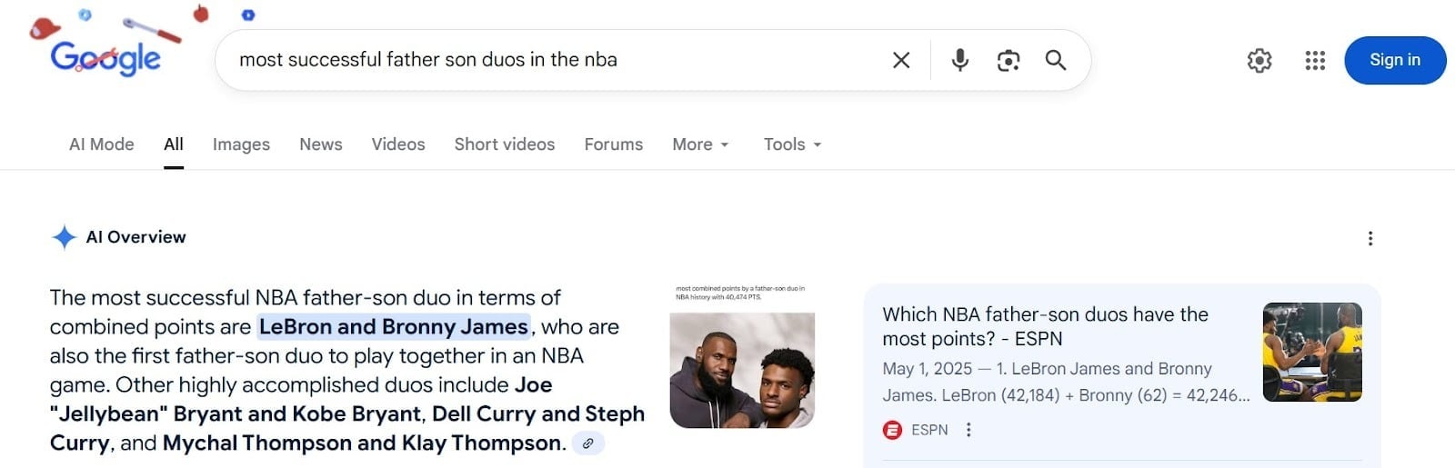 ```json
{
"alt": "Google search result for most successful NBA father-son duos, highlighting LeBron and Bronny James.",
"caption": "Discover the NBA's top father-son duos, with LeBron and Bronny James leading in combined points. A legacy of basketball excellence!",
"description": "This image shows a Google search result for the most successful NBA father-son duos. LeBron and Bronny James are highlighted as the duo with the highest combined points, also noted for being the first to play together in the NBA. The search includes information such as ESPN's coverage and mentions other famous duos like Kobe and Joe ‘Jellybean’ Bryant, and Dell and Steph Curry. Ideal for basketball enthusiasts exploring player legacies."
}
```