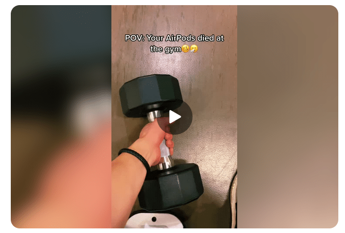 ```json
{
  "alt": "Person holding a dumbbell at the gym, with text saying 'Your AirPods died at the gym' and emoji expressions.",
  "caption": "When your motivation gets heavy! A classic gym moment – your AirPods gave up, but you didn’t. Feel the silence and lift on!",
  "description": "Image shows a close-up of a person’s hand gripping a black dumbbell at the gym. The text overlay humorously reads 'POV: Your AirPods died at the gym' with laughing emojis, depicting the common scenario of exercising without music due to AirPods losing charge. This relatable gym scene captures the blend of determination and humor. Keywords: gym, dumbbell, AirPods, workout, humor."
}
```