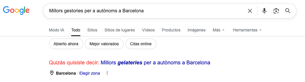 ```json
{
"alt": "Google search showing suggestion for 'business managers' corrected to 'ice cream shops' in Barcelona.",
"caption": "A Google search mix-up turns a query for business managers into a quirky suggestion for ice cream parlors in Barcelona.",
"description": "This image displays a Google search results page where a query for 'Millors gestories per a autònoms a Barcelona' (best business managers for freelancers in Barcelona) is humorously corrected to 'Millors gelateries per a autònoms a Barcelona' (best ice cream shops for freelancers in Barcelona). The suggestion is highlighted in blue under a prompt reading 'Quizás quisiste decir' (Did you mean). Tabs for search modes like 'Modo IA', 'Todo', and others are visible. Keywords: Google search, autocorrect fail, Barcelona, business, ice cream."
}
```