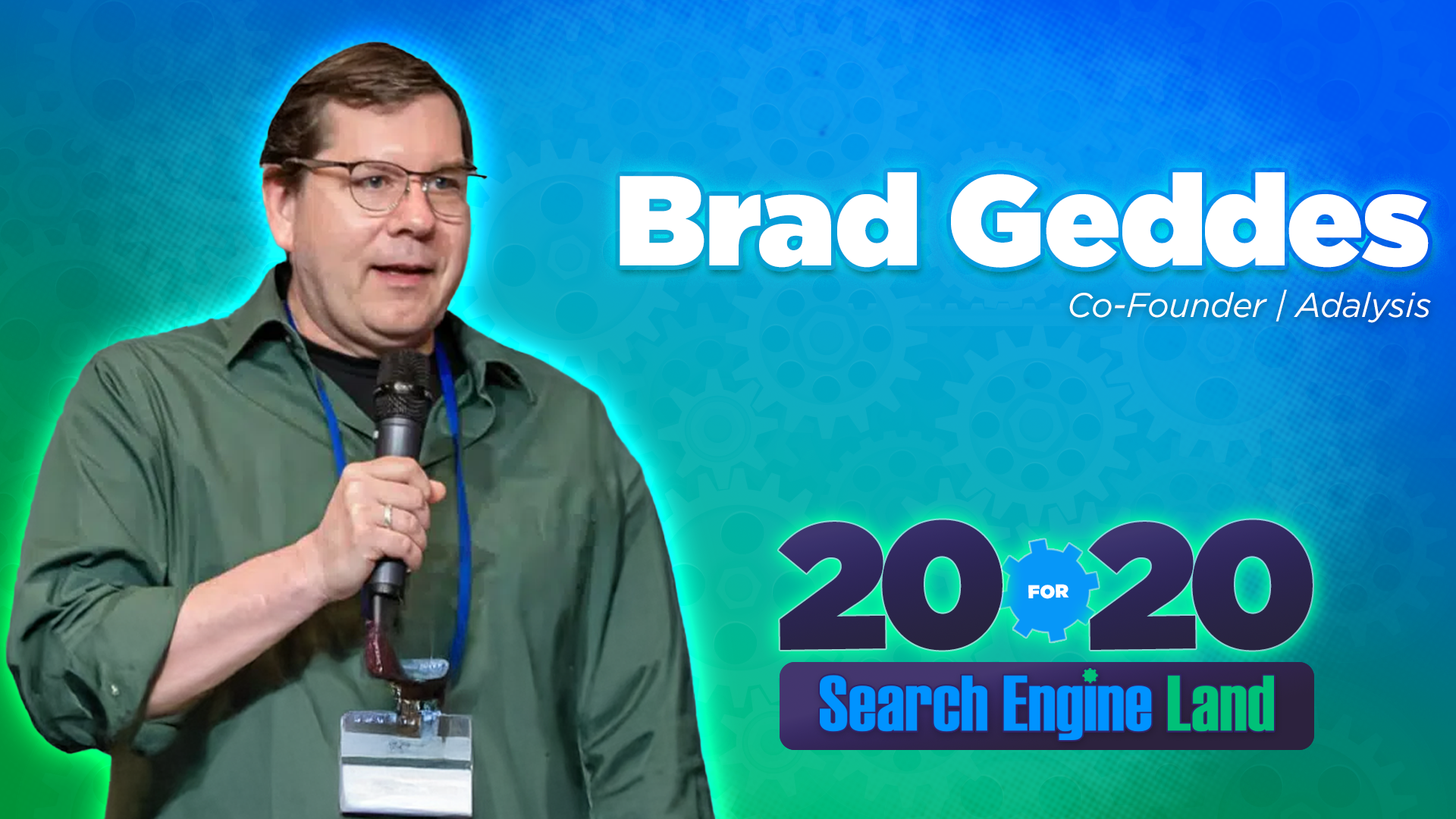 ```json
{
"alt": "Man in green shirt holding a microphone against a blue background with text about the Search Engine Land event.",
"caption": "Speeches and tech insights: A glimpse into the Search Engine Land 20 for 20 event, where innovation meets inspiration.",
"description": "A man wearing glasses and a green shirt holds a microphone, speaking at the Search Engine Land event. The backdrop is blue with gears and features bold text, highlighting the '20 for 20 Search Engine Land' theme. Keywords: tech event, public speaking, digital marketing."
}
```