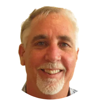 ```json
{
  "alt": "Smiling man with short white hair and a goatee.",
  "caption": "A warmly smiling man exudes friendliness and approachability. A perfect portrait capturing a genuine, inviting demeanor.",
  "description": "A portrait of a man with short white hair and a goatee, smiling warmly at the camera. The close-up shot highlights his friendly expression against a plain white background. The image is framed in a circular border, making it ideal for profile or professional use. Keywords: portrait, smiling man, friendly, approachable."
}
```