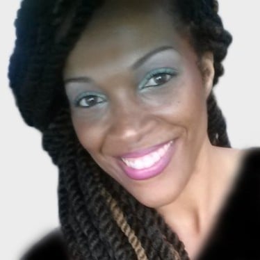 ```json
{
  "alt": "Smiling person with long braided hair and vibrant makeup.",
  "caption": "Radiant smile and stunning makeup highlight the beauty of long braided hair.",
  "description": "The image features a person with long, twisted braids and a bright smile. Their makeup includes shimmering eyeshadow and pink lipstick, complementing their skin tone. The background is a neutral gradient, drawing focus to the subject's vibrant expression and hairstyle."
}
```